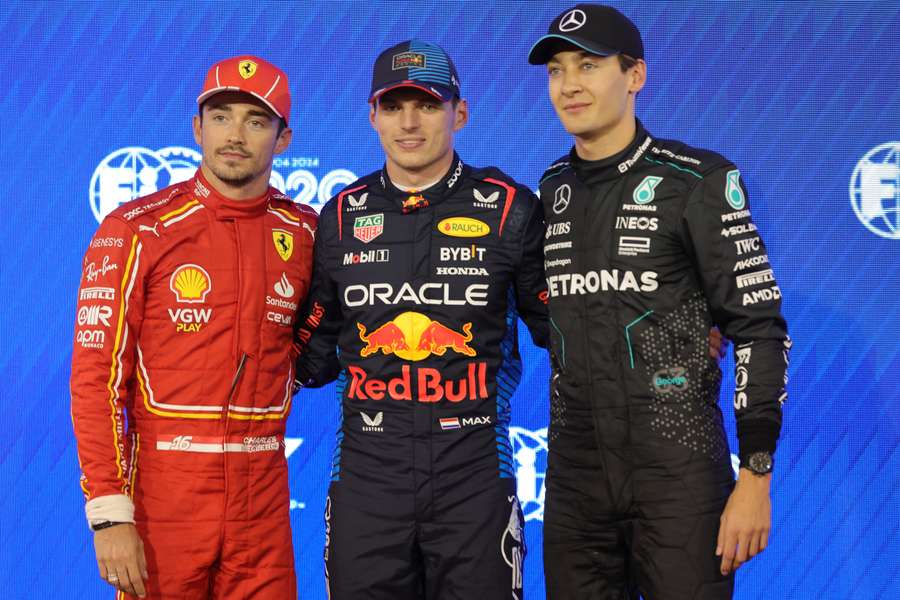 Red Bull Racing's driver Max Verstappen (C) poses along with Ferrari's driver Charles Leclerc (L) and Mercedes' driver George Russell