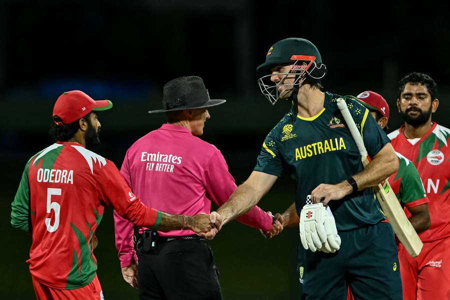 Australia's captain Mitchell Marsh shakes hands with Oman's players at the end of the match Australia's captain Mitchell Marsh shakes hands with Oman's players at the end of the match