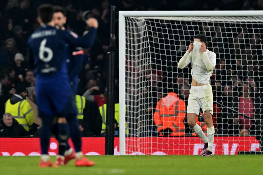 Arsenal's German midfielder #29 Kai Havertz (C) reacts after missing a penalty