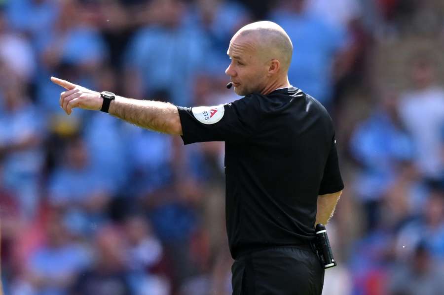 Referee Paul Tierney gestures during the FA Cup final