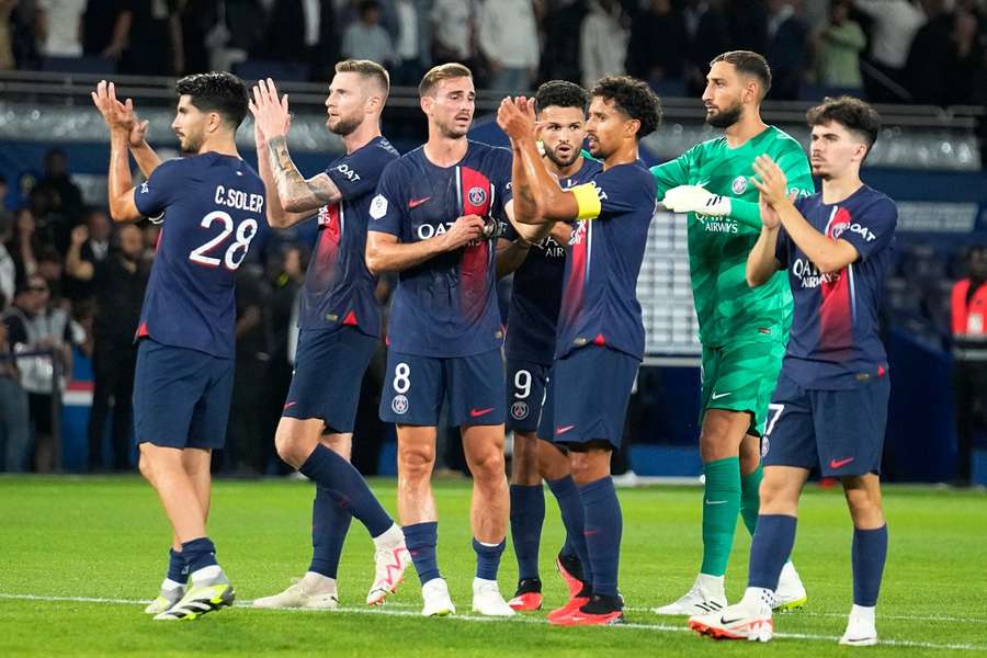 PSG players applaud fans after the match