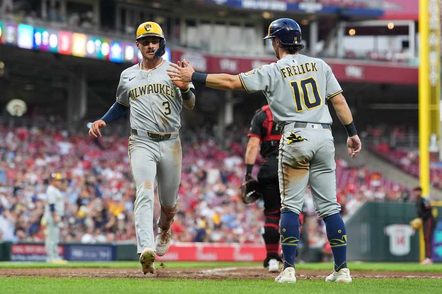 Milwaukee Brewers Joey Ortiz (left) high-fives teammate Sal Frelick (right) after scoring (2025) Milwaukee Brewers Joey Ortiz (left) high-fives teammate Sal Frelick (right) after scoring (2025)