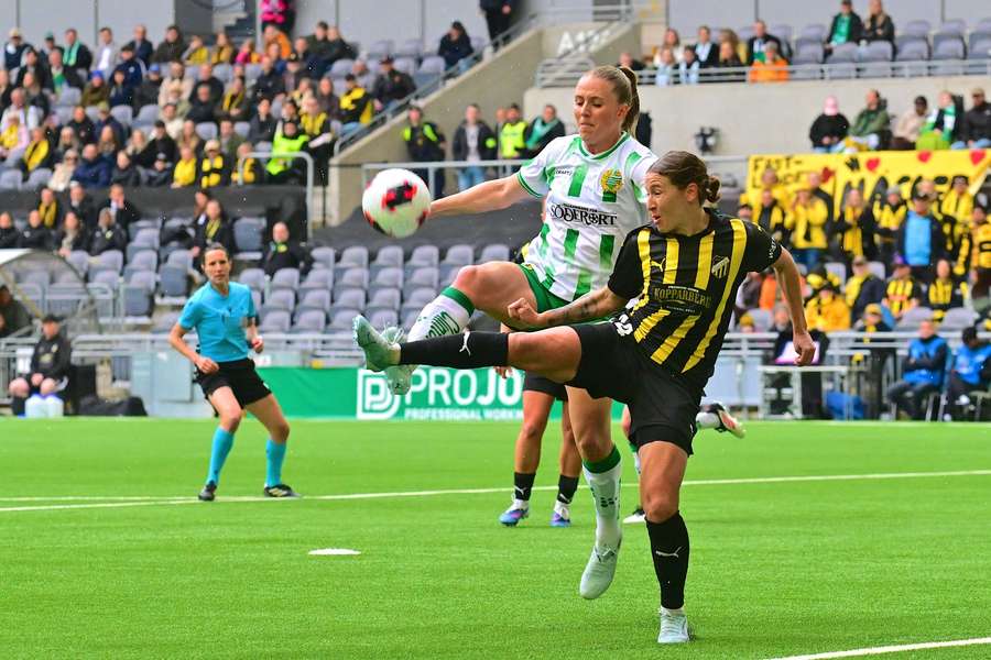 Tabby Tindell (right) fights for possession vs Hammarby