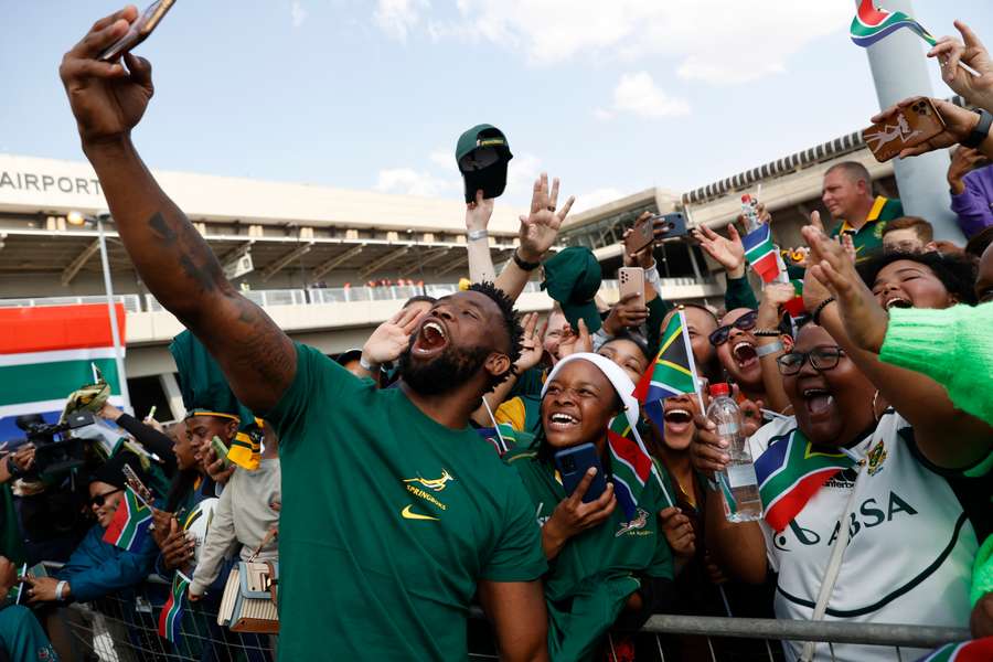 South Africa captain Siya Kolisi takes a picture with fans during the team’s departure ceremony on Saturday
