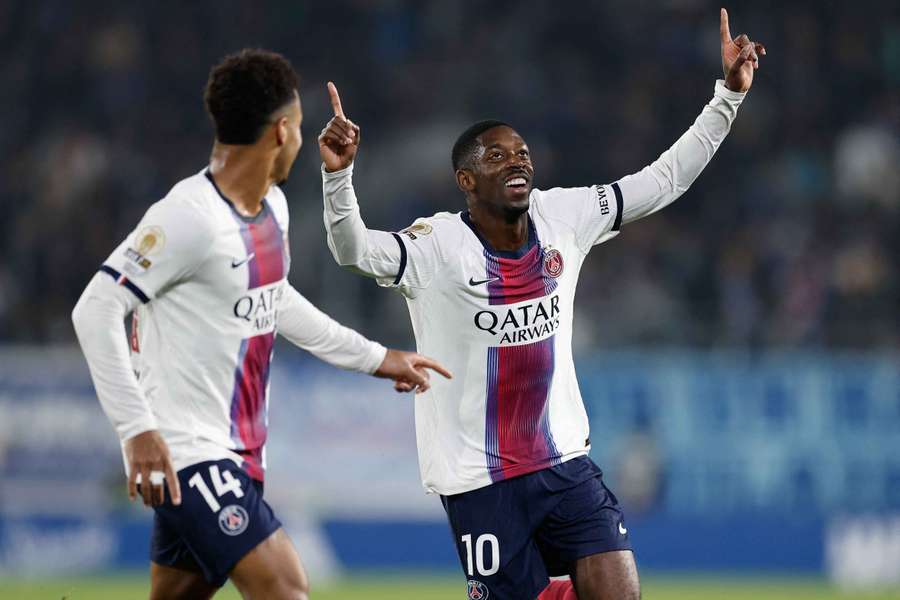 Dembele (R) celebrates his goal