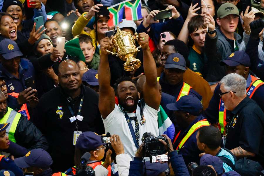South Africa captain Siya Kolisi lifts the trophy