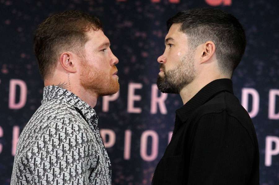 Canelo Alvarez and John Ryder pose for a picture during a press conference