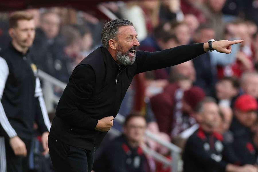 Hearts boss Derek McIness pointing his finger