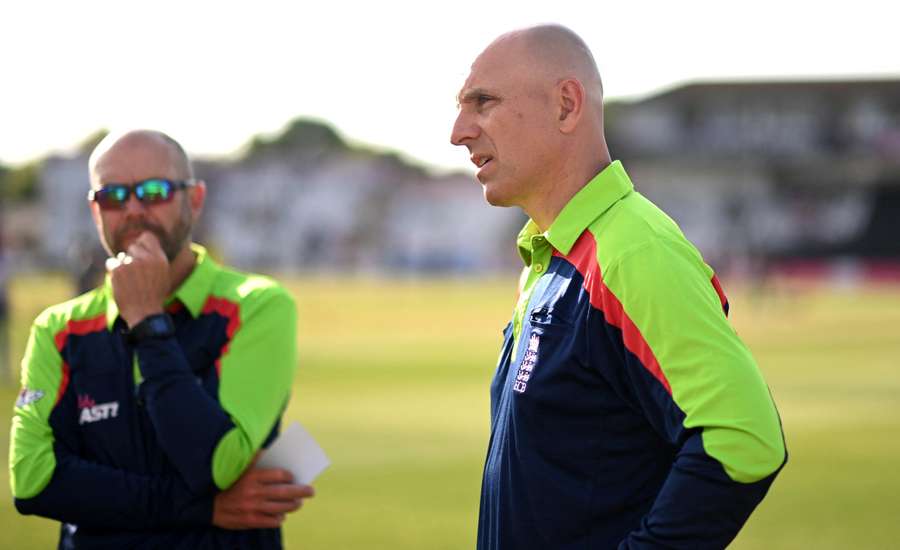 Umpires Mike Burns and Alex Wharf (R) look on