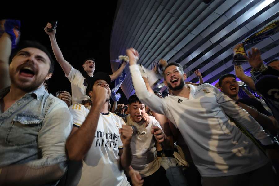 Madrid supporters celebrate a historic win