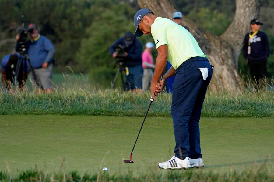 Xander Schauffele putts on the 15th green during the second round of the U.S. Open