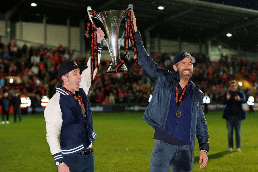 Reynolds and McElhenney celebrate the promotion and league title