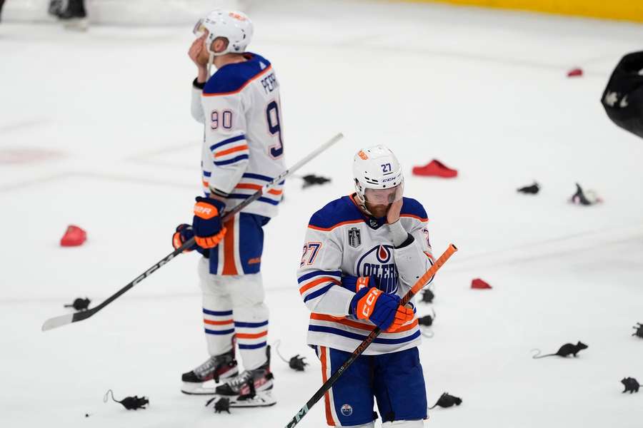 Oilers players react after their loss