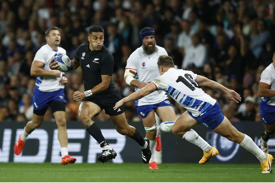 New Zealand's Rieko Ioane in action before scoring their eleventh try