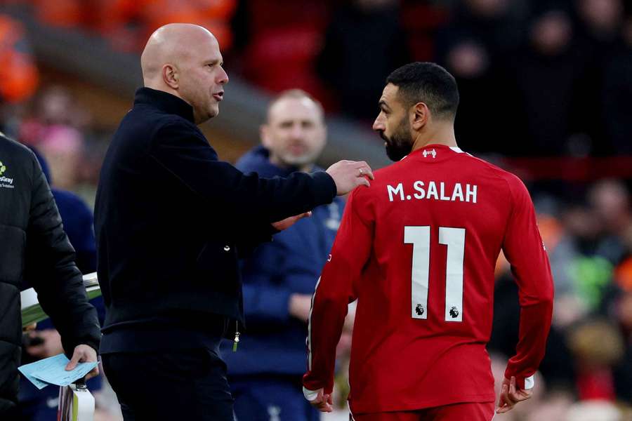 Liverpool manager Arne Slot with Mohamed Salah before he comes on as a substitute