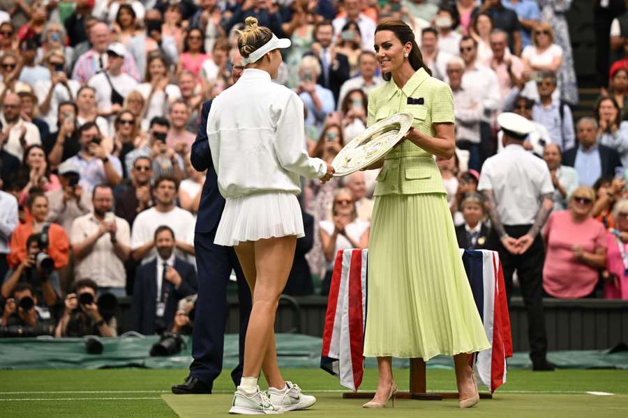 Marketa Vondrousova receives the Rosewater Dish from the Princess of Wales