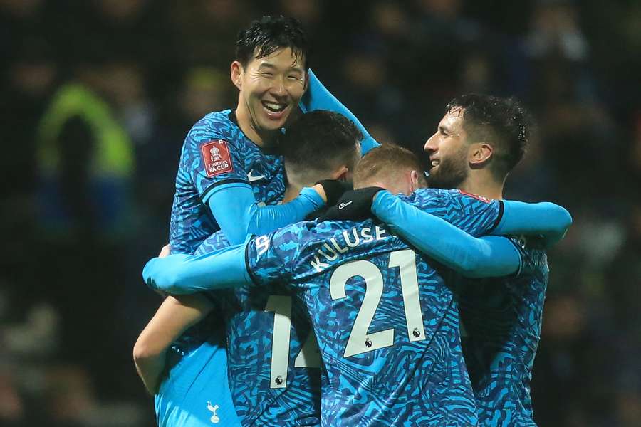 Tottenham Hotspur's South Korean striker Son Heung-Min celebrates with teammates after scoring their second goal 