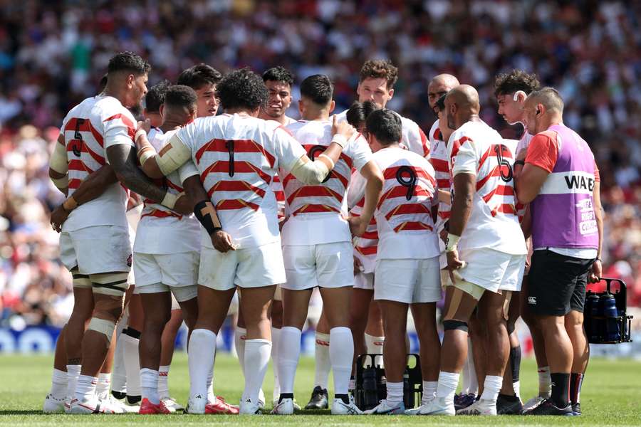 Japan take a water break during their match with Chile