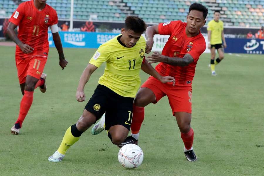 Malaysia in action against Myanmar