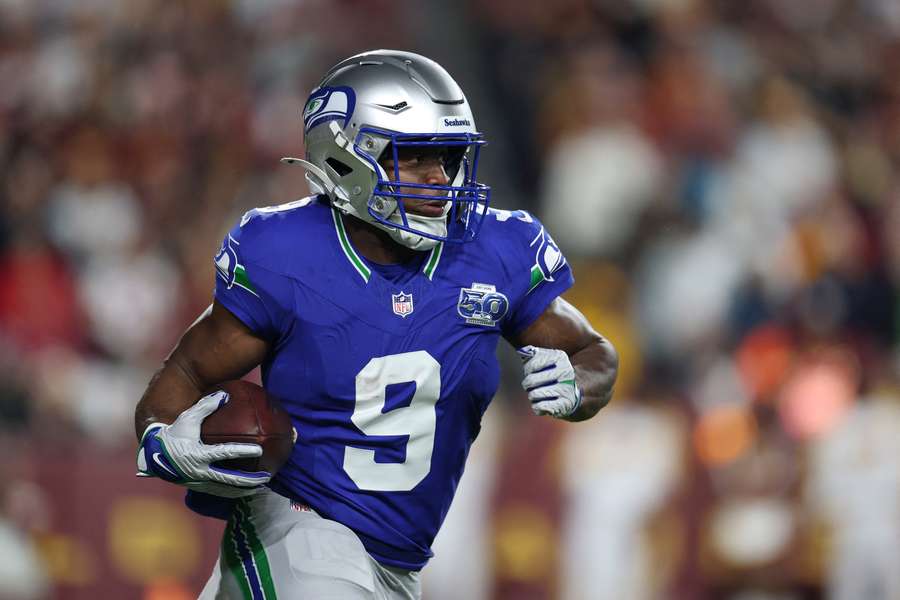 Kenneth Walker III runs the ball for the Seattle Seahawks