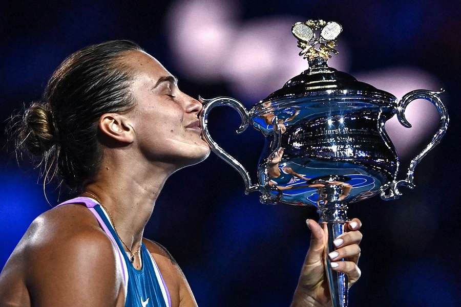 Belarus' Aryna Sabalenka celebrates with the Daphne Akhurst Memorial Cup after defeating Kazakhstan's Elena Rybakina 