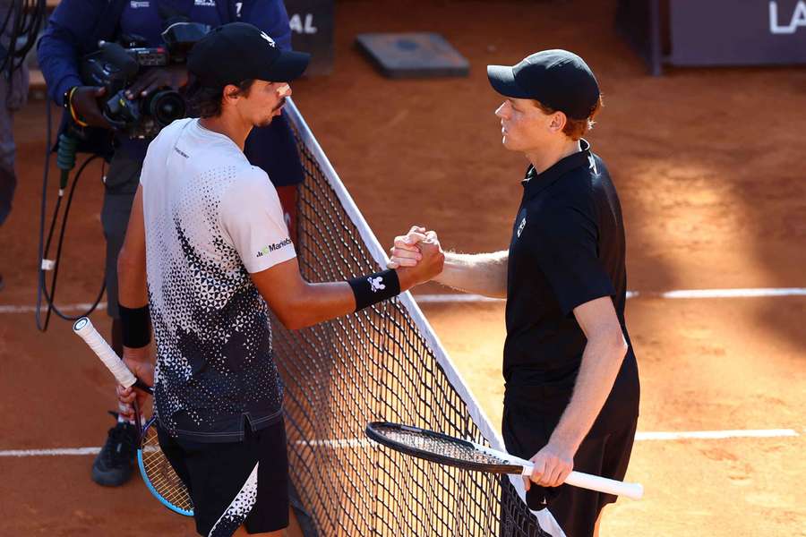 Jannik Sinner and Alexei Popyrin meet after the match