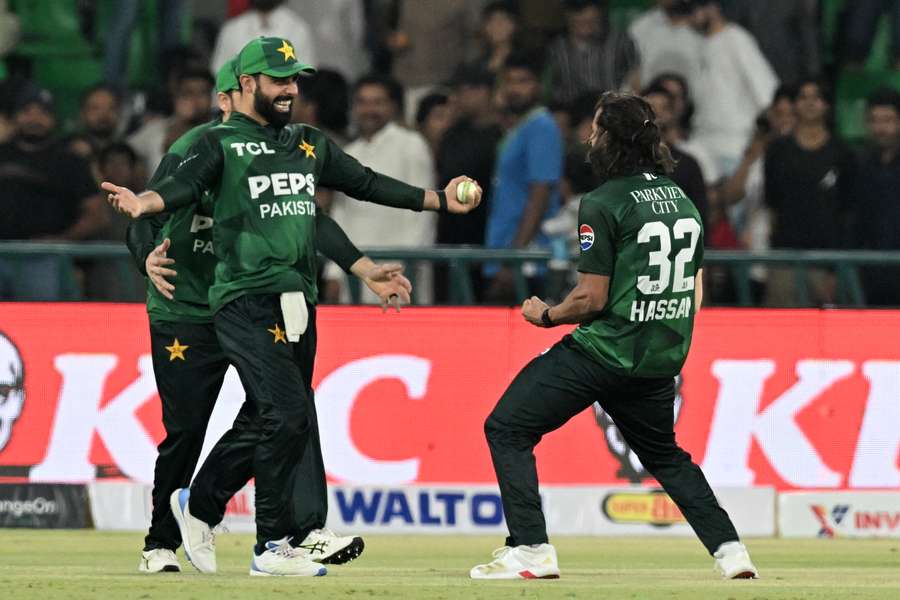 Hasan Ali celebrates his five-wicket haul with vice-captain Shadab Khan.