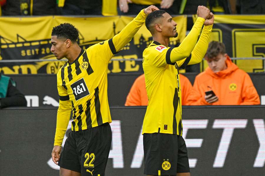 Sebastien Haller celebrates scoring with teammate Jude Bellingham