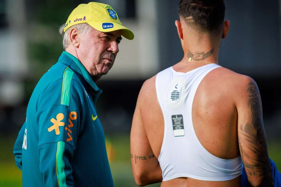 Brazil boss Carlo Ancelotti (L) in training