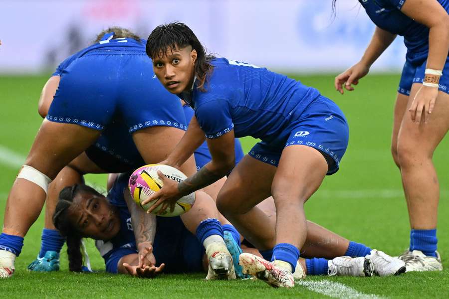 Samoa scrum-half Ana-Maria Afuie plays the ball during a pool game against England.