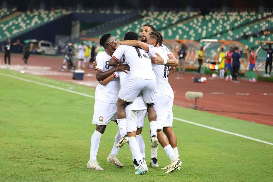 Kenya players celebrate scoring against Gambia