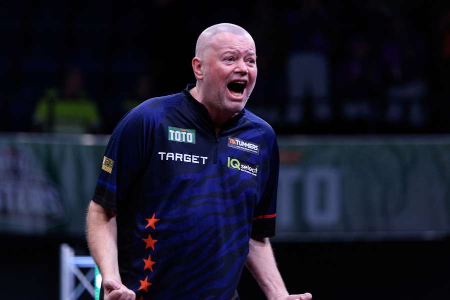 Raymond van Barneveld celebrates after beating Chris Dobey at the Dutch Darts Masters