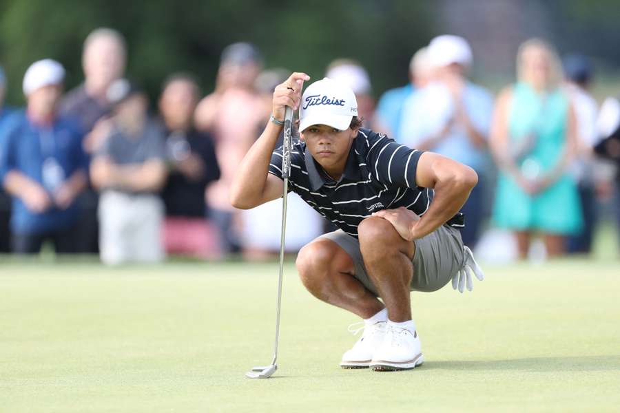 Charlie Woods of the United States lines up his putt on the third hole on day one of the 76th U.S. Junior Amateur Championship