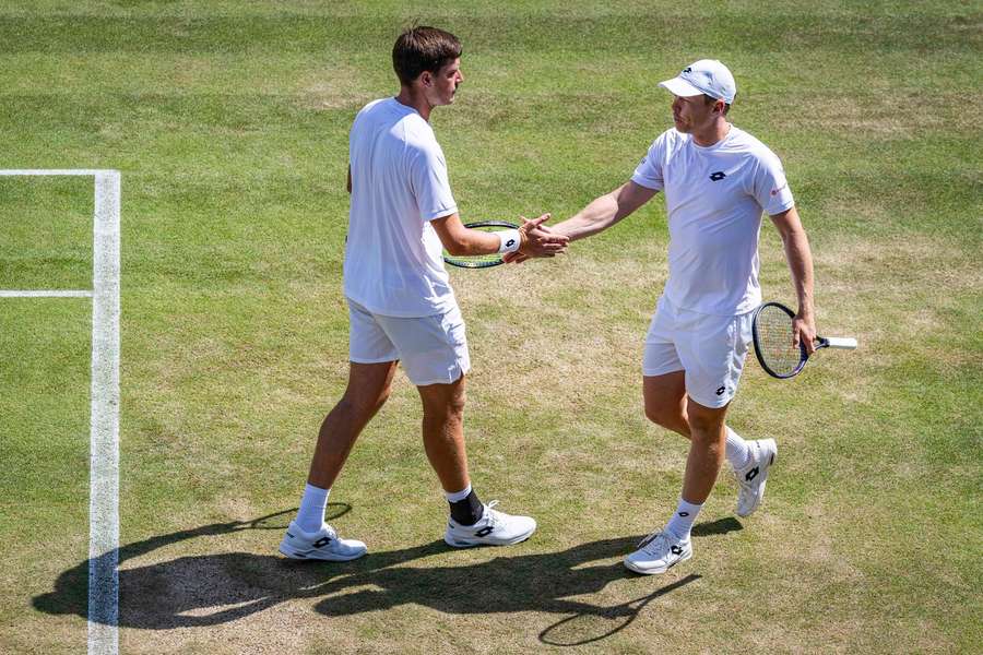Heliovaara (right) and Patten during their three-set win Heliovaara (right) and Patten during their three-set win