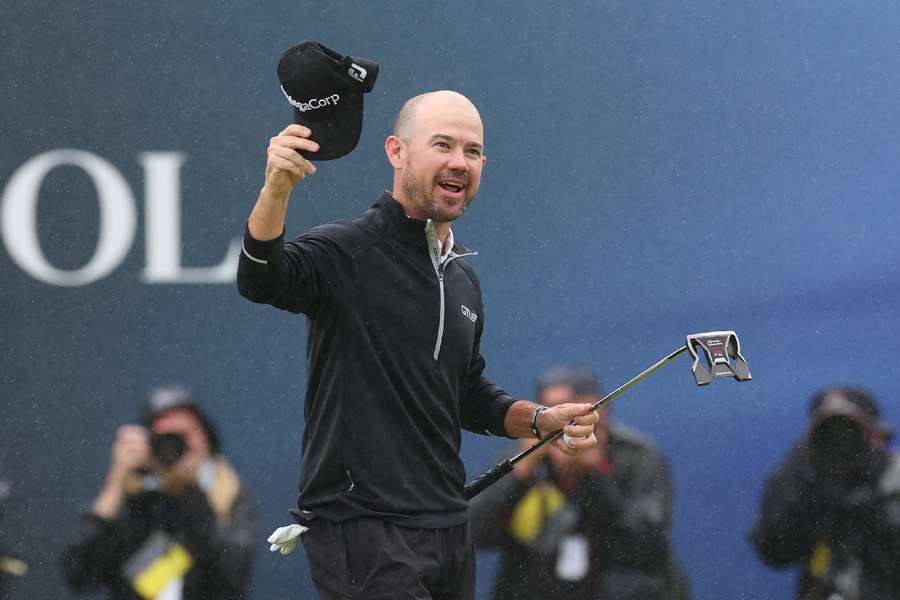 Brian Harman celebrates on the 18th green after winning the 151st Open Championship