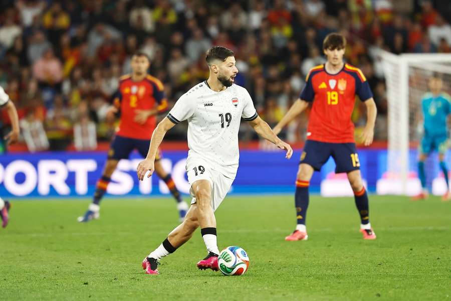 Kevin Yakob in action against Spain in a pre-World Cup friendly