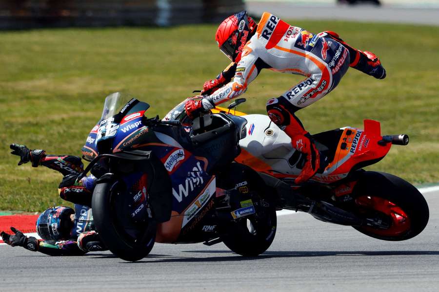 Repsol Honda Team's Marc Marquez and CryptoDATA RNF MotoGP Team's Miguel Oliveira after colliding
