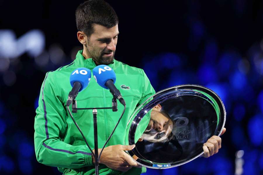Novak Djokovic with the runners up trophy after losing the Australian Open men's singles against Carlos Alcaraz