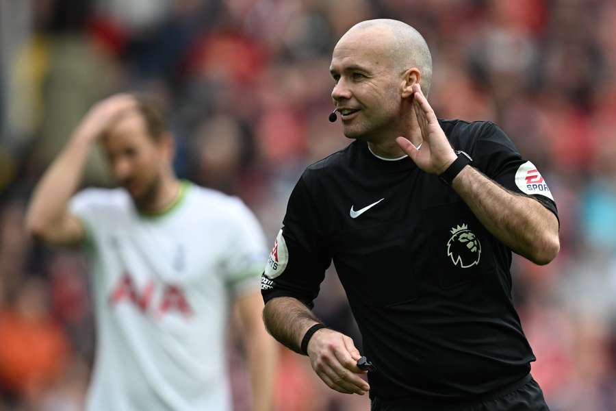 English referee Paul Tierney gestures during the English Premier League football match between Liverpool and Tottenham Hotspur at Anfield