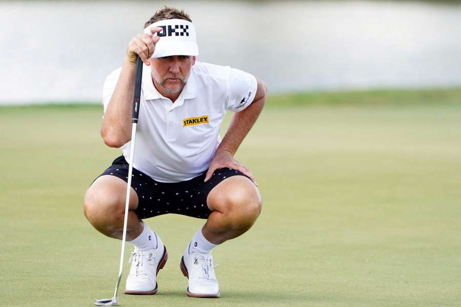 Poulter looks over his putt during the season finale of the LIV Golf series