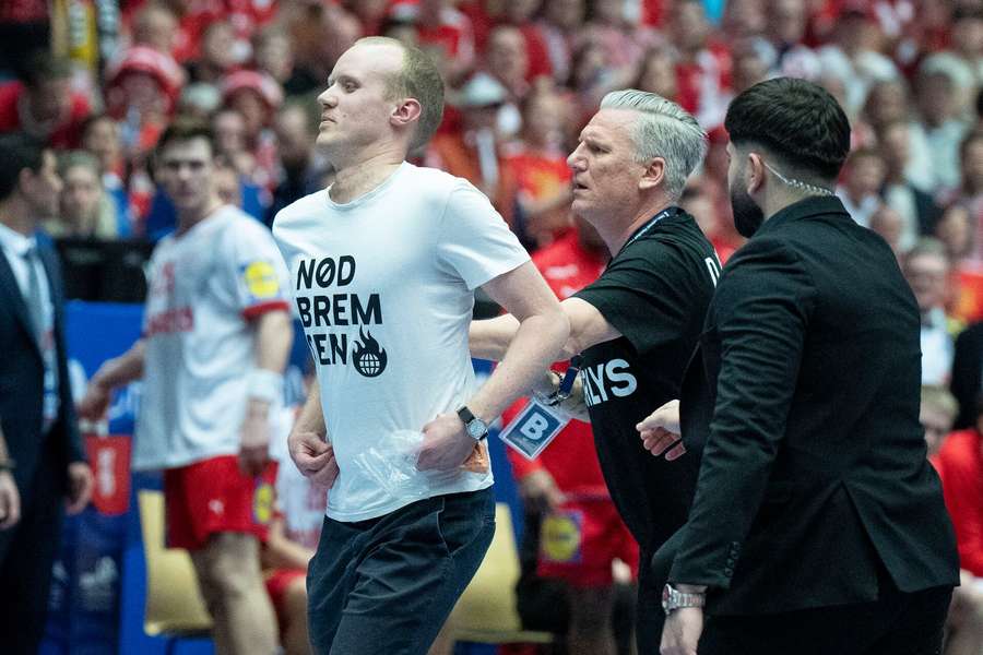 Danish coach acted as bouncer when security failed to deal with court invader