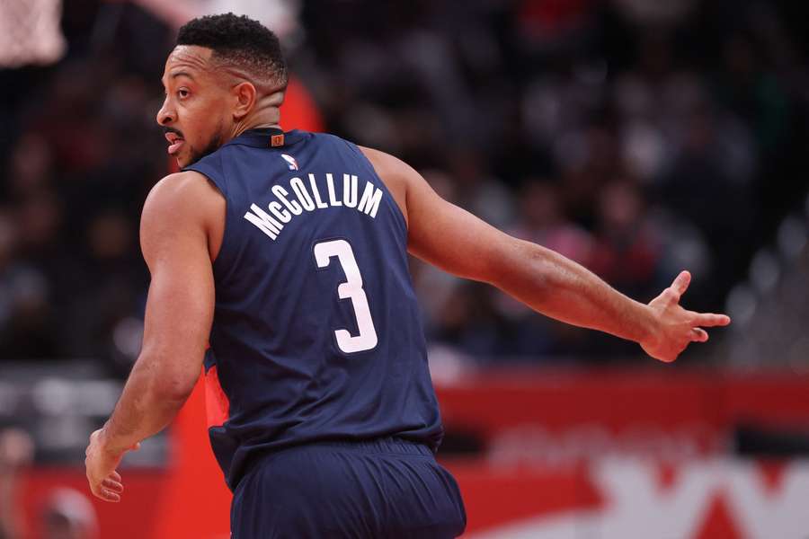 Wizards' CJ McCollum reacts after making a three-point shot (2025)