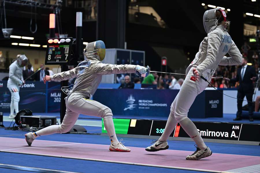 Ukraine's Olha Kharlan (L) and Russia's Anna Smirnova, registered as an Individual Neutral Athlete (AIN), compete during the Sabre Women's Senior Individual qualifiers