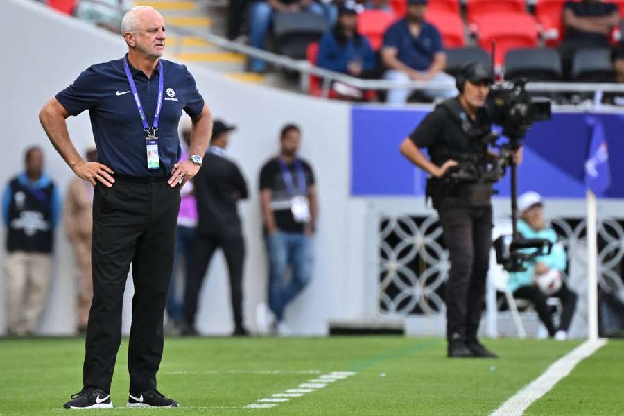 Australia manager Graham Arnold (L)