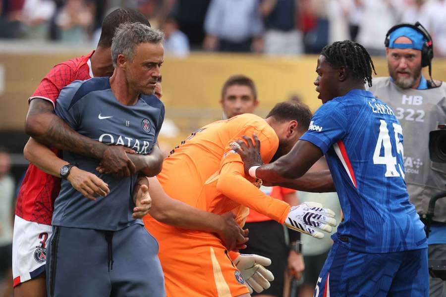 Luis Enrique being held back by one of his players