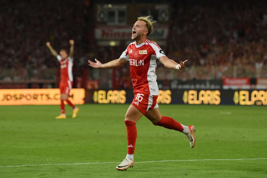 Benedict Hollerbach of Union Berlin celebrates scoring the winner