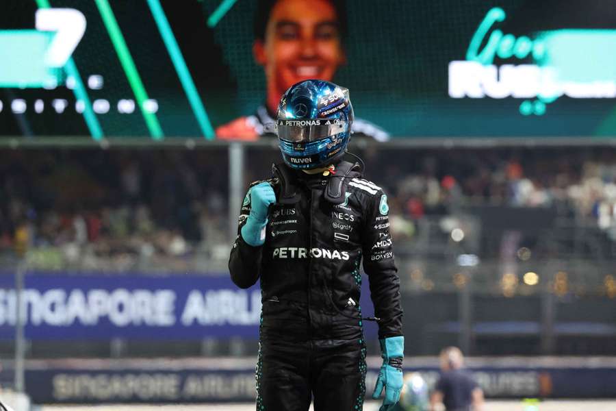 Mercedes' George Russell celebrates after qualifying in pole position in Singapore