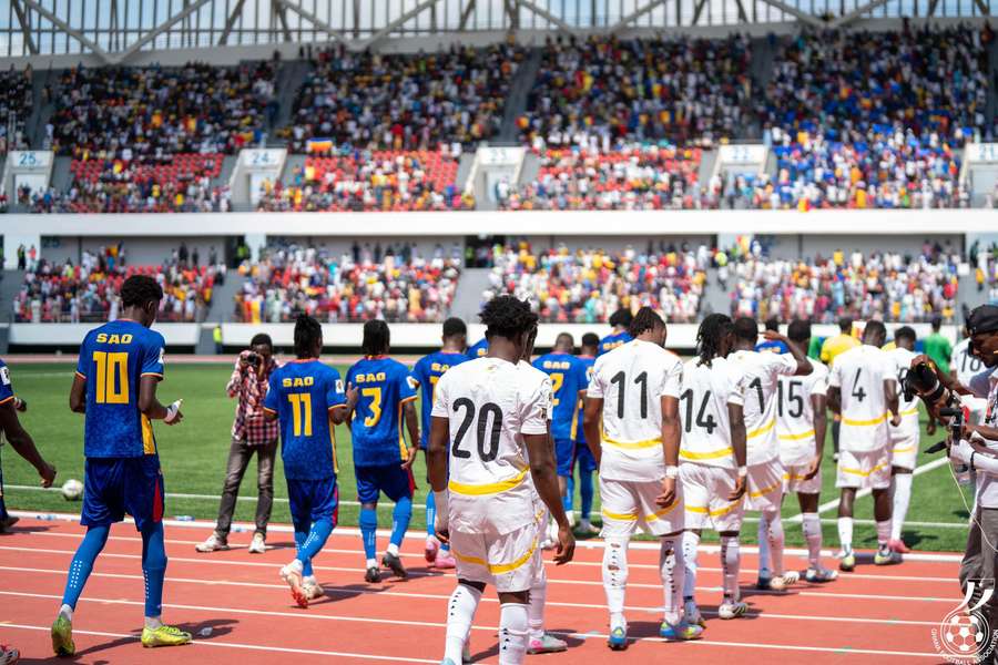 Chad and Ghana walk onto the pitch