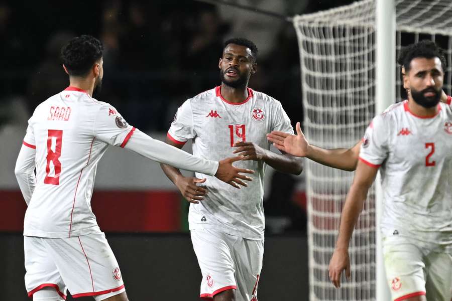 Tunisia's Firas Chaouat (centre) celebrates scoring against Mali Tunisia's Firas Chaouat (centre) celebrates scoring against Mali