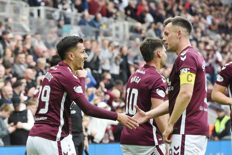 Hearts' Kyziridis and Shankland celebrate